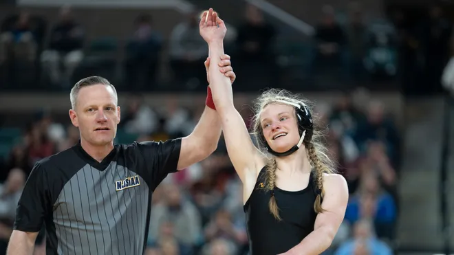 River Dell wrestler getting hand raised