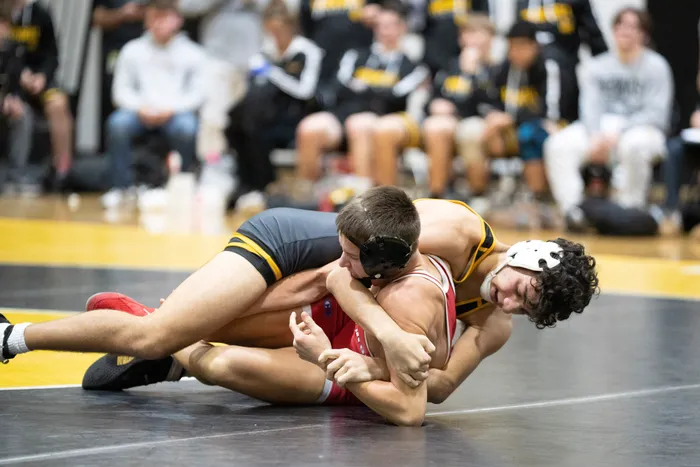 Hawks wrestler controlling on top